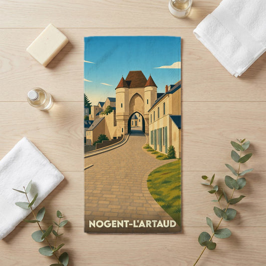 Serviette de bain souvenir de la ville de Nogent-l'Artaud avec une illustration stylisée d'une porte de ville historique.