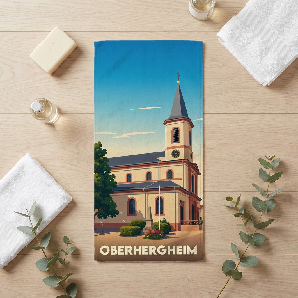 Serviette de bain souvenir de la ville d'Oberhergheim avec une illustration stylisée de son église.