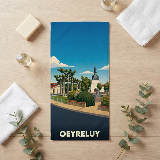 Serviette de bain souvenir de la ville de Oeyreluy avec une illustration stylisée.