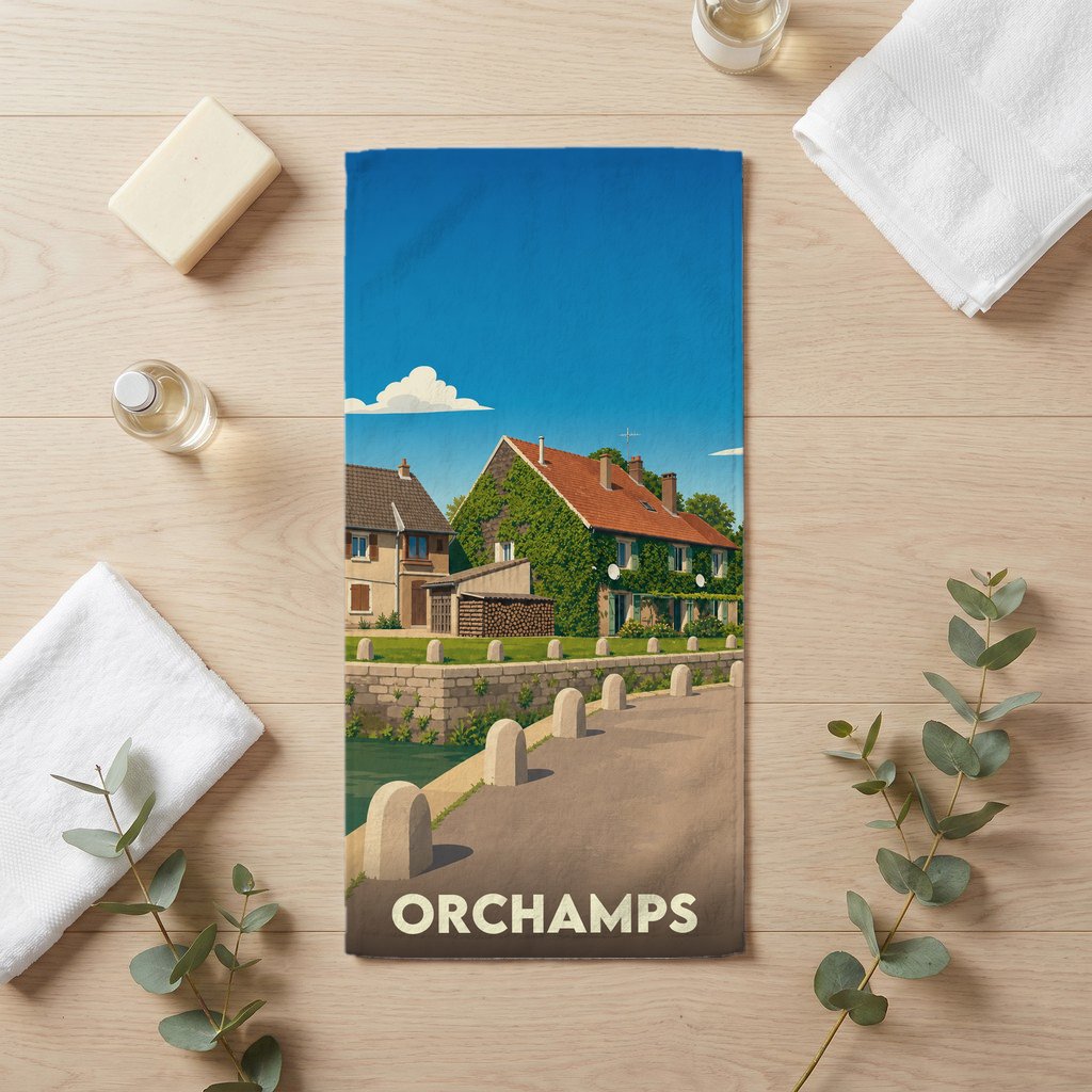 Serviette de bain souvenir de la ville de Orchamps avec une illustration stylisée d'un paysage urbain.