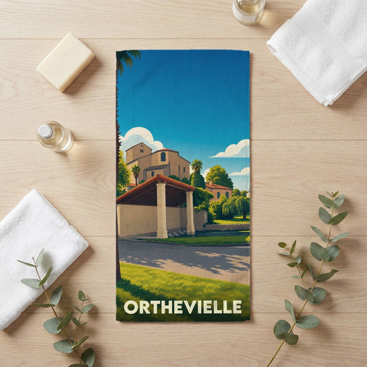 Serviette de bain souvenir de la ville d'Orthevielle avec une illustration stylisée.