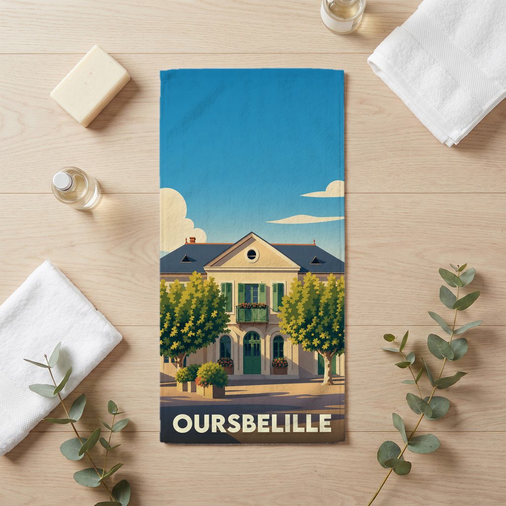 Serviette de bain souvenir de la ville de Oursbelille avec une illustration stylisée d'un bâtiment classique.