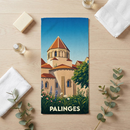 Serviette de bain souvenir de la ville de Palinges avec une illustration stylisée de son église et de fleurs sauvages.