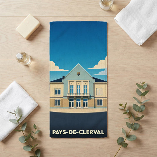 Serviette de bain souvenir de la ville de Pays-de-Clerval avec une illustration stylisée de son architecture.