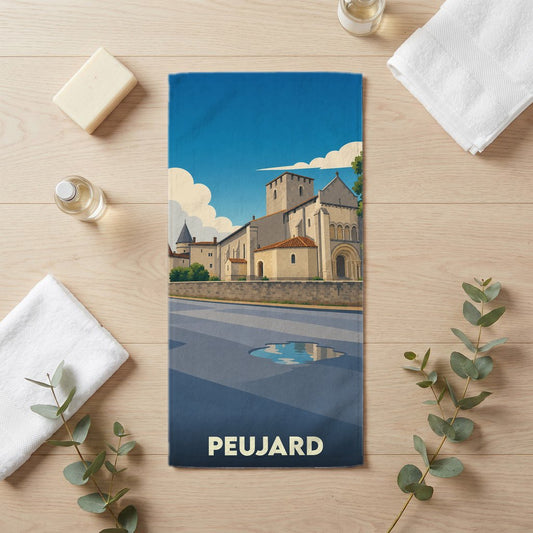 Serviette de bain souvenir de la ville de Peujard avec une illustration stylisée d'une église ancienne.