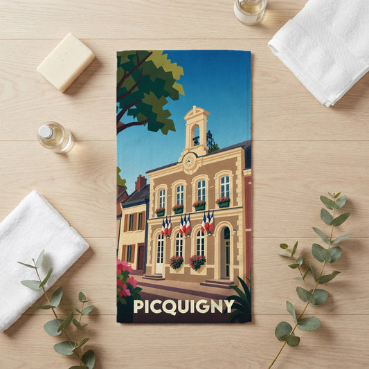 Serviette de bain souvenir de la ville de Picquigny avec une illustration stylisée de son hôtel de ville.