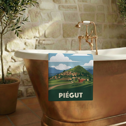 Serviette de bain souvenir de la ville de Piégut avec une illustration stylisée de son paysage.
