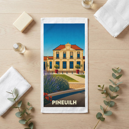 Serviette souvenir de la ville de Pineuilh avec une illustration stylisée.