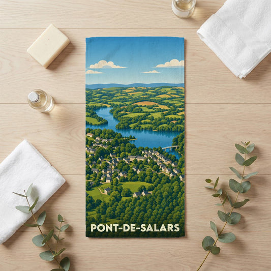 Serviette de bain souvenir de Pont-de-Salars illustrée d'un paysage panoramique stylisé.