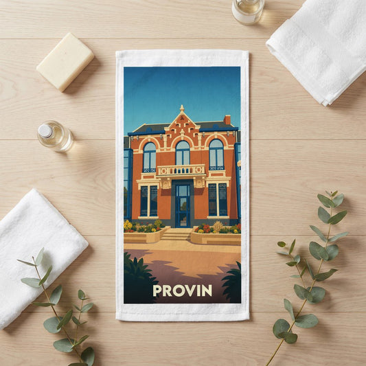 Serviette de bain souvenir de la ville de Provin avec une illustration stylisée d'un bâtiment historique.