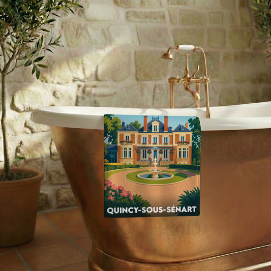 Serviette de bain souvenir de Quincy-sous-Sénart illustrée d'un manoir et d'une fontaine dans un style rétro.