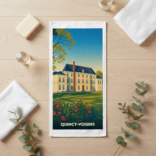 Serviette de bain souvenir de la ville de Quincy-Voisins avec une illustration stylisée d'un château.