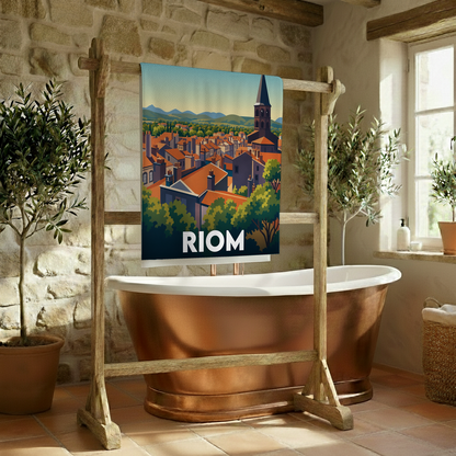 Serviette de bain souvenir de la ville de Riom avec une illustration stylisée de ses toits et son clocher.