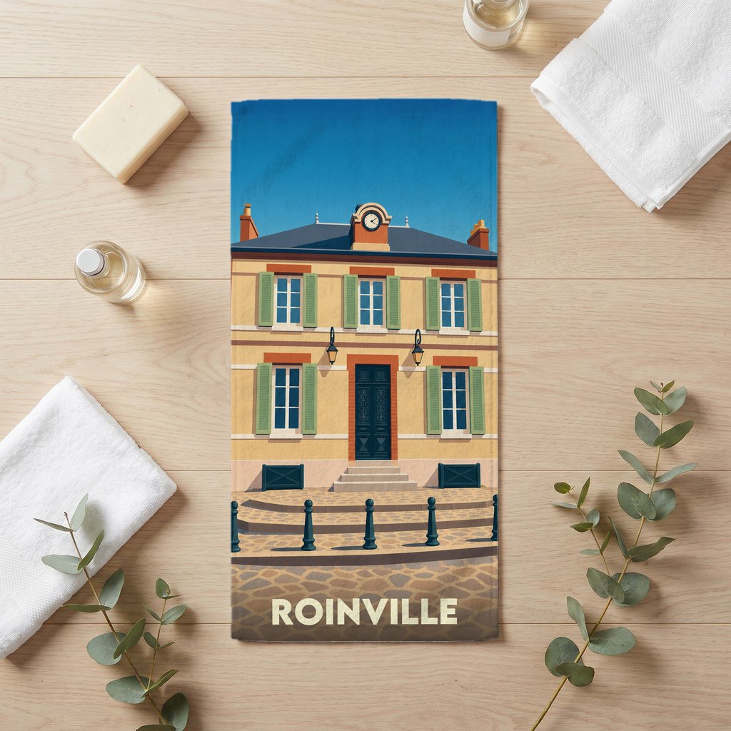 Serviette de bain souvenir de la ville de Roinville avec une illustration stylisée de la mairie.
