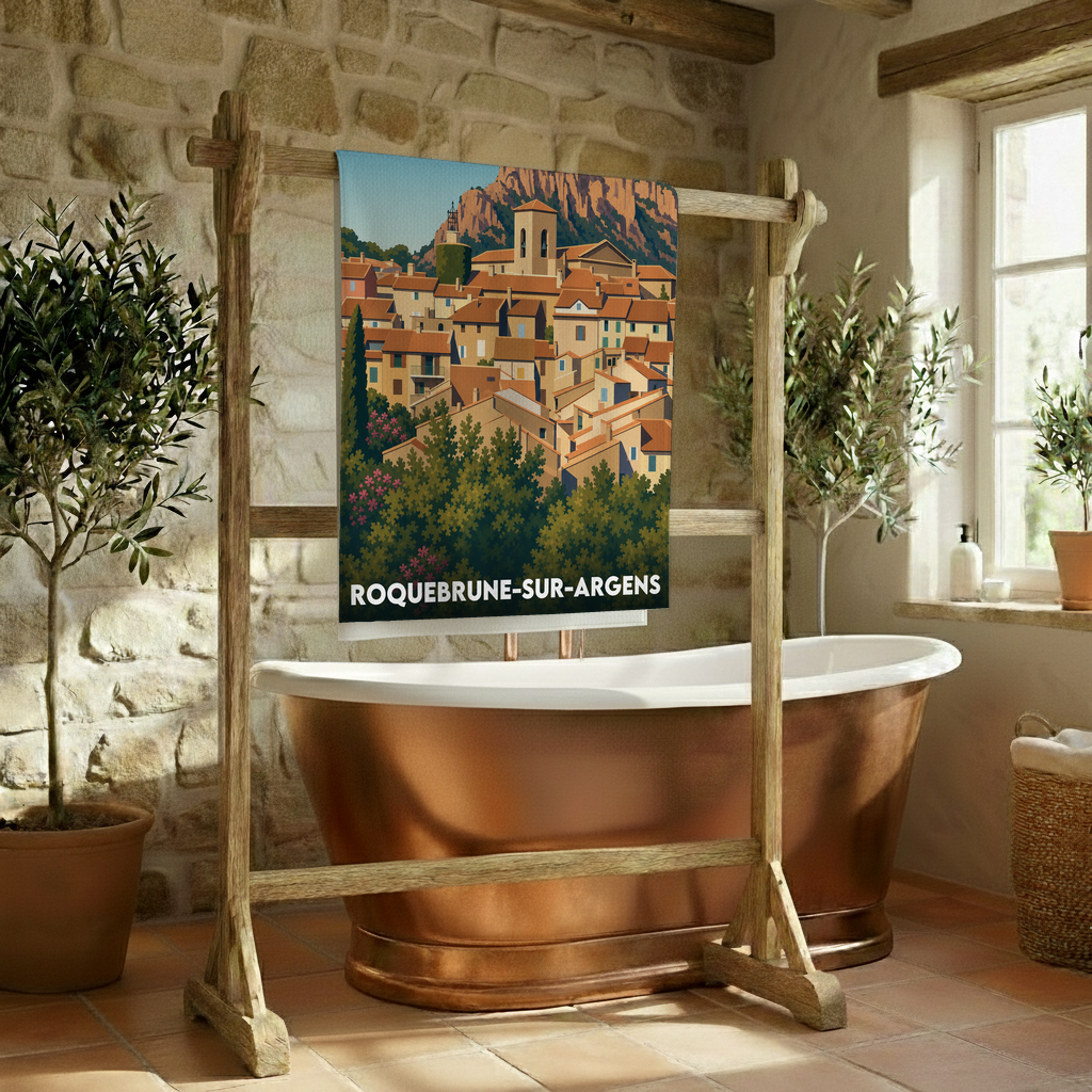 Serviette de bain souvenir de la ville de Roquebrune-sur-Argens avec une illustration stylisée.