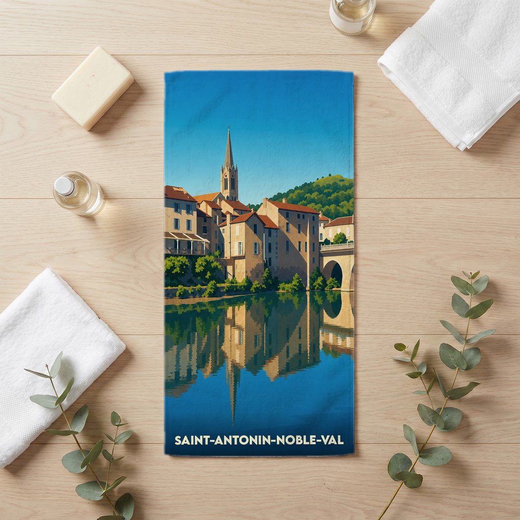 Serviette de bain souvenir de la ville de Saint-Antonin-Noble-Val avec une illustration stylisée.
