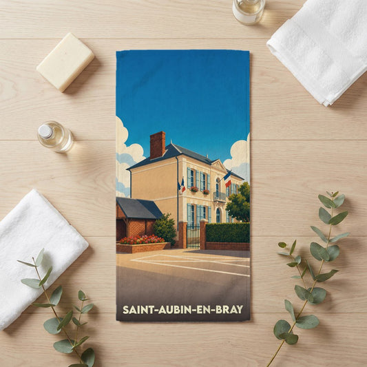 Serviette de bain souvenir de la ville de Saint-Aubin-en-Bray avec une illustration stylisée d'un bâtiment typique.