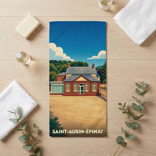 Serviette de bain souvenir de la ville de Saint-Aubin-Épinay avec une illustration stylisée d'un bâtiment remarquable.