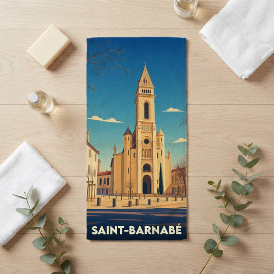Serviette de bain souvenir de Saint-Barnabé avec une illustration stylisée de son église.