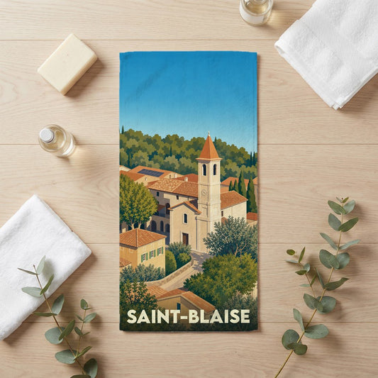 Serviette de bain souvenir de la ville de Saint-Blaise avec une illustration stylisée du village et de son église.