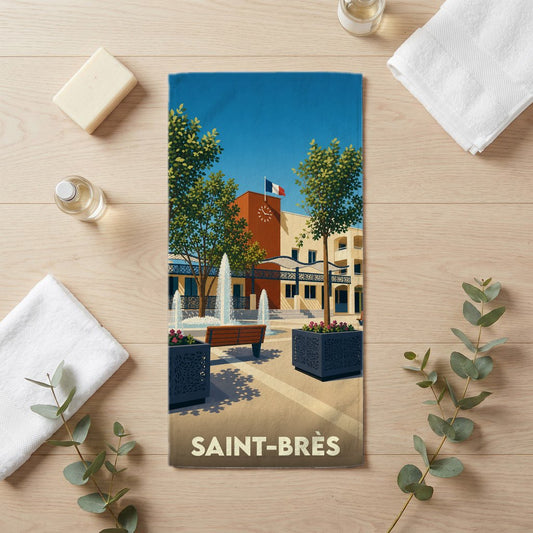 Serviette de bain souvenir de la ville de Saint-Brès avec une illustration stylisée.