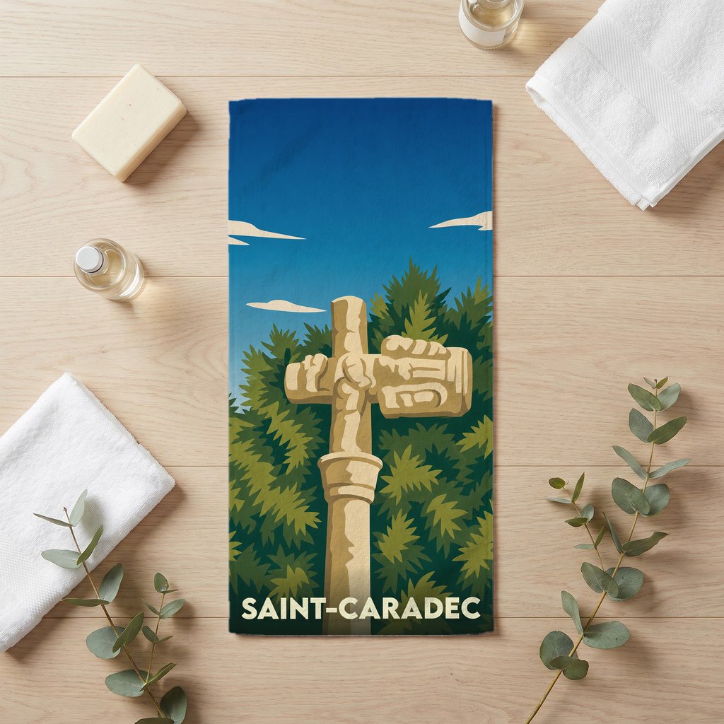 Serviette de bain souvenir de la ville de Saint-Caradec avec une illustration stylisée d'un calvaire breton.