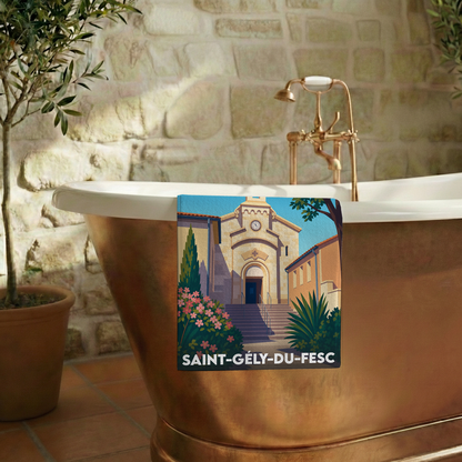 Serviette de bain souvenir de la ville de Saint-Gély-du-Fesc avec une illustration stylisée de son église.