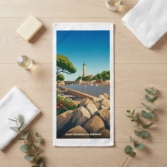 Serviette de bain souvenir de la ville de Saint-Georges-de-Didonne avec une illustration stylisée de son phare et de sa côte.