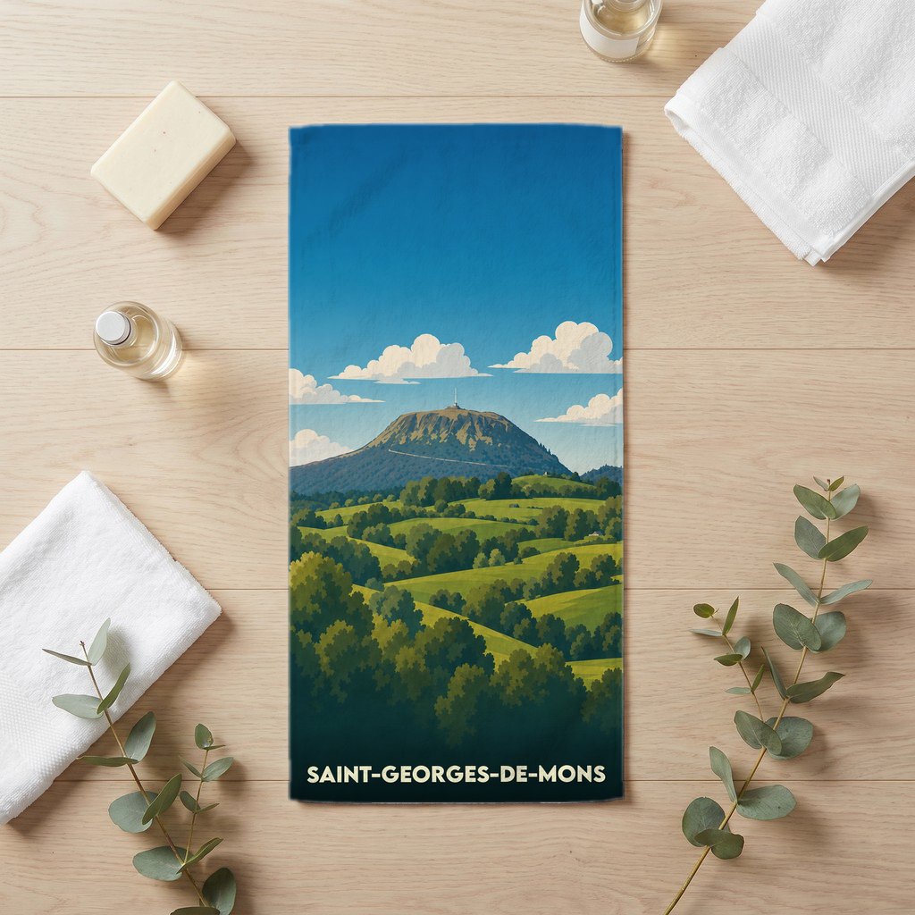 Serviette de bain souvenir de Saint-Georges-de-Mons avec une illustration stylisée du Puy de Dôme.