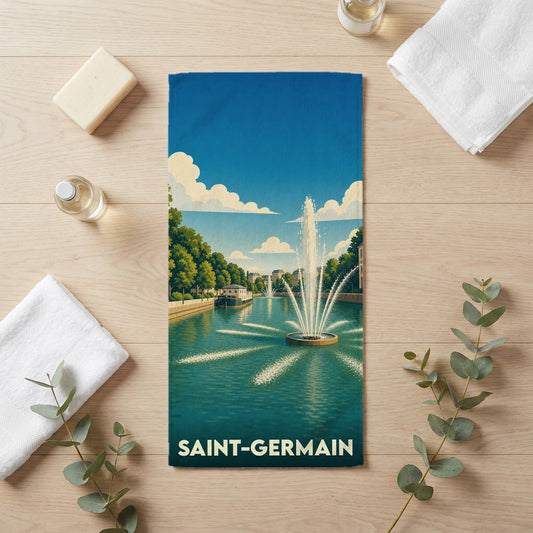 Serviette de bain souvenir de la ville de Saint-Germain avec une illustration stylisée d'un canal et de ses fontaines.