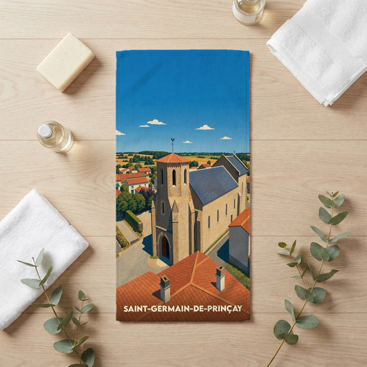 Serviette de bain souvenir de Saint-Germain-de-Prinçay illustrant l'église du village sous un ciel bleu.