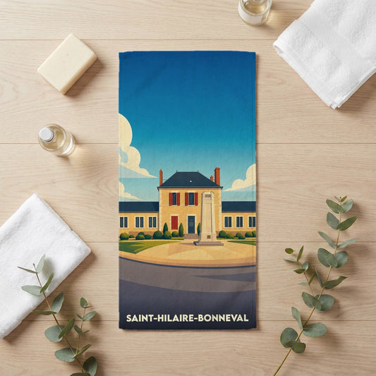 Serviette de bain souvenir de la ville de Saint-Hilaire-Bonneval avec une illustration stylisée.