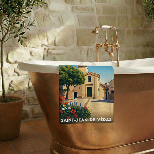 Serviette de bain souvenir de Saint-Jean-de-Védas avec une illustration stylisée de son église.