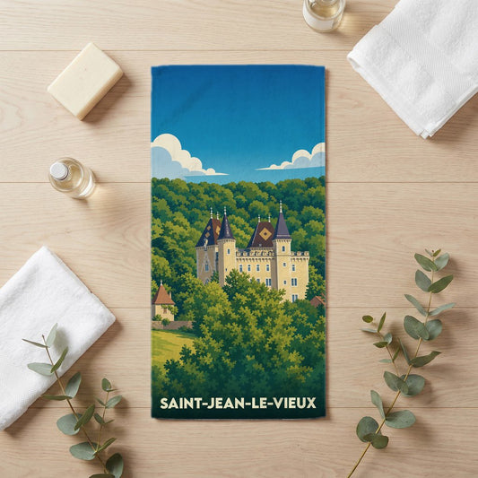 Serviette de bain souvenir de Saint-Jean-le-Vieux illustrée d'un château niché dans une forêt verdoyante.