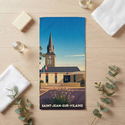 Serviette de bain souvenir de Saint-Jean-sur-Vilaine avec une illustration stylisée de son église et de sa mairie.