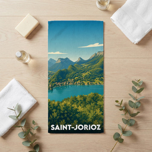 Serviette de bain souvenir de la ville de Saint-Jorioz avec une illustration de paysage de montagne et de lac.