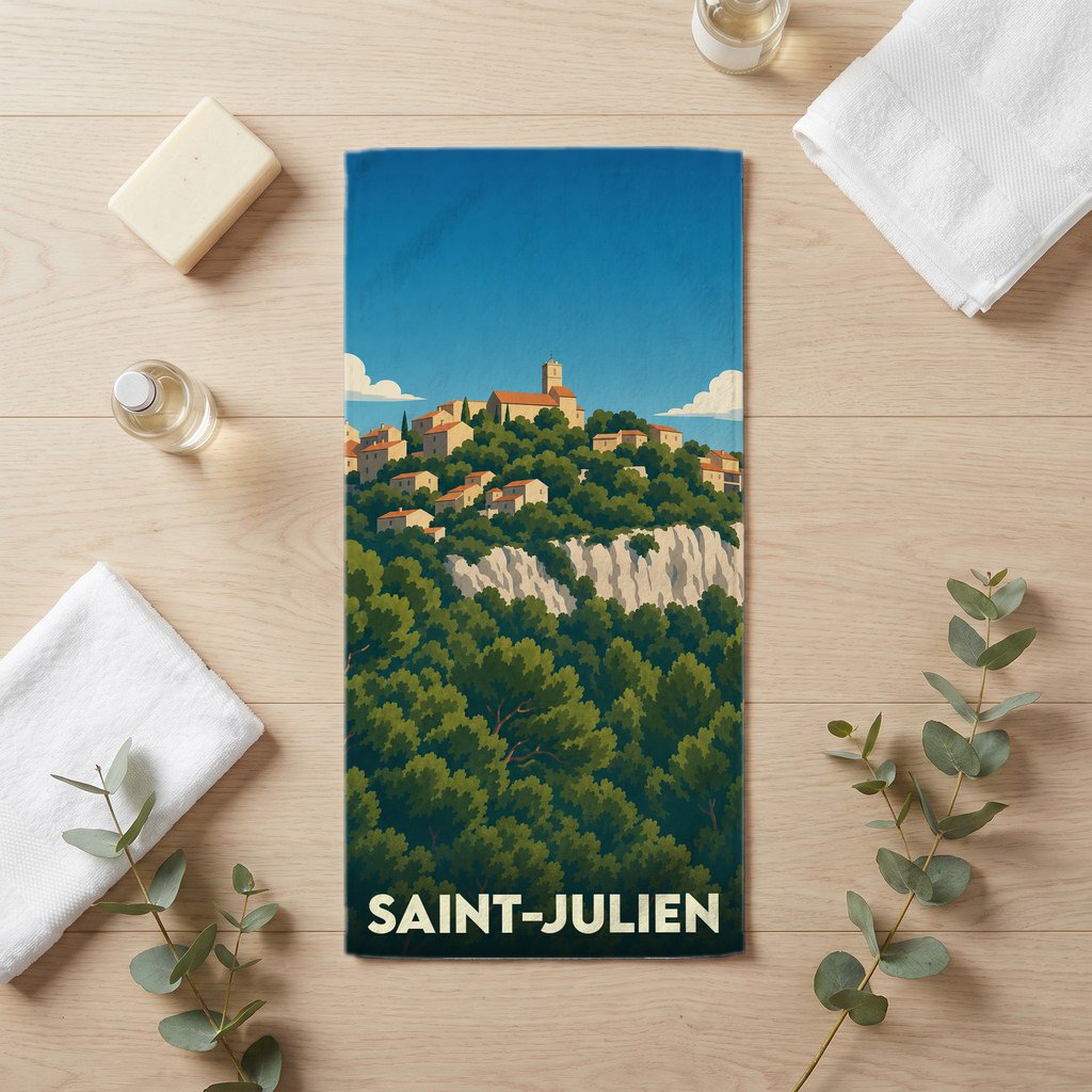 Serviette de bain souvenir de la ville de Saint-Julien avec une illustration stylisée d'un village perché.