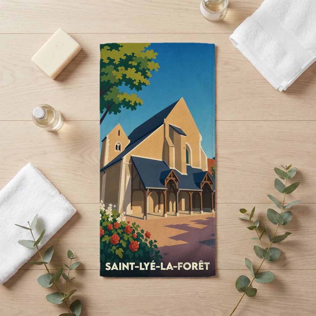 Serviette de bain souvenir de Saint-Lyé-la-Forêt illustrée d'une église de style médiéval.