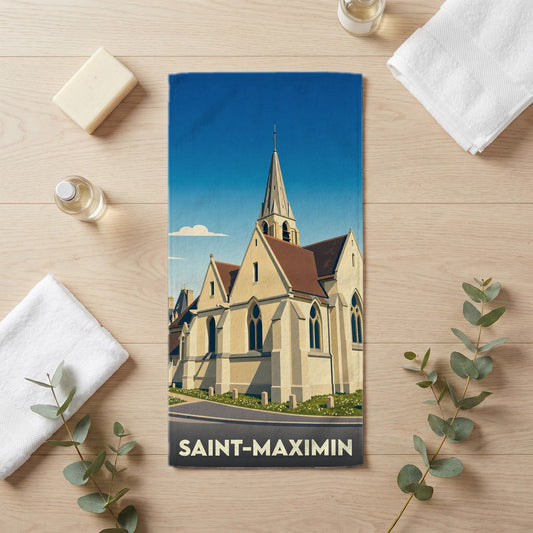 Serviette de bain souvenir de la ville de Saint-Maximin avec une illustration stylisée de son église.