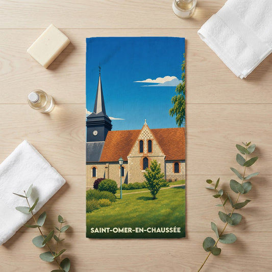 Serviette de bain souvenir de Saint-Omer-en-Chaussée avec une illustration stylisée de son église.