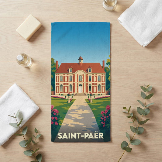 Serviette de bain souvenir de la ville de Saint-Paër avec une illustration stylisée d'un château.