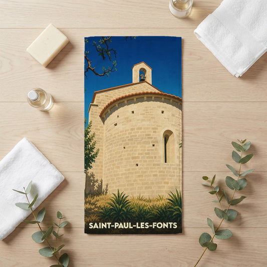 Serviette de bain souvenir de Saint-Paul-les-Fonts avec l'illustration d'une chapelle romane.