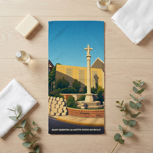 Serviette de bain souvenir de Saint-Quentin-la-Motte-Croix-au-Bailly avec une illustration stylisée.