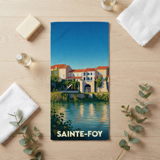 Serviette de bain souvenir de la ville de Sainte-Foy avec une illustration stylisée d'un paysage de bord de rivière.