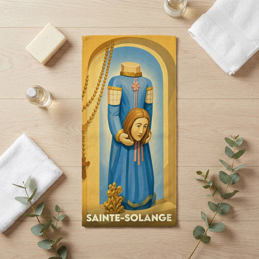 Serviette de bain souvenir de la ville de Sainte-Solange illustrée d'une représentation stylisée de la sainte.