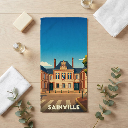 Serviette de bain souvenir de la ville de Sainville avec une illustration stylisée de sa mairie.
