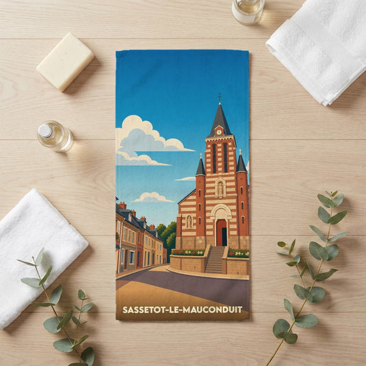 Serviette de bain souvenir de la ville de Sassetot-le-Mauconduit avec une illustration stylisée de son église.