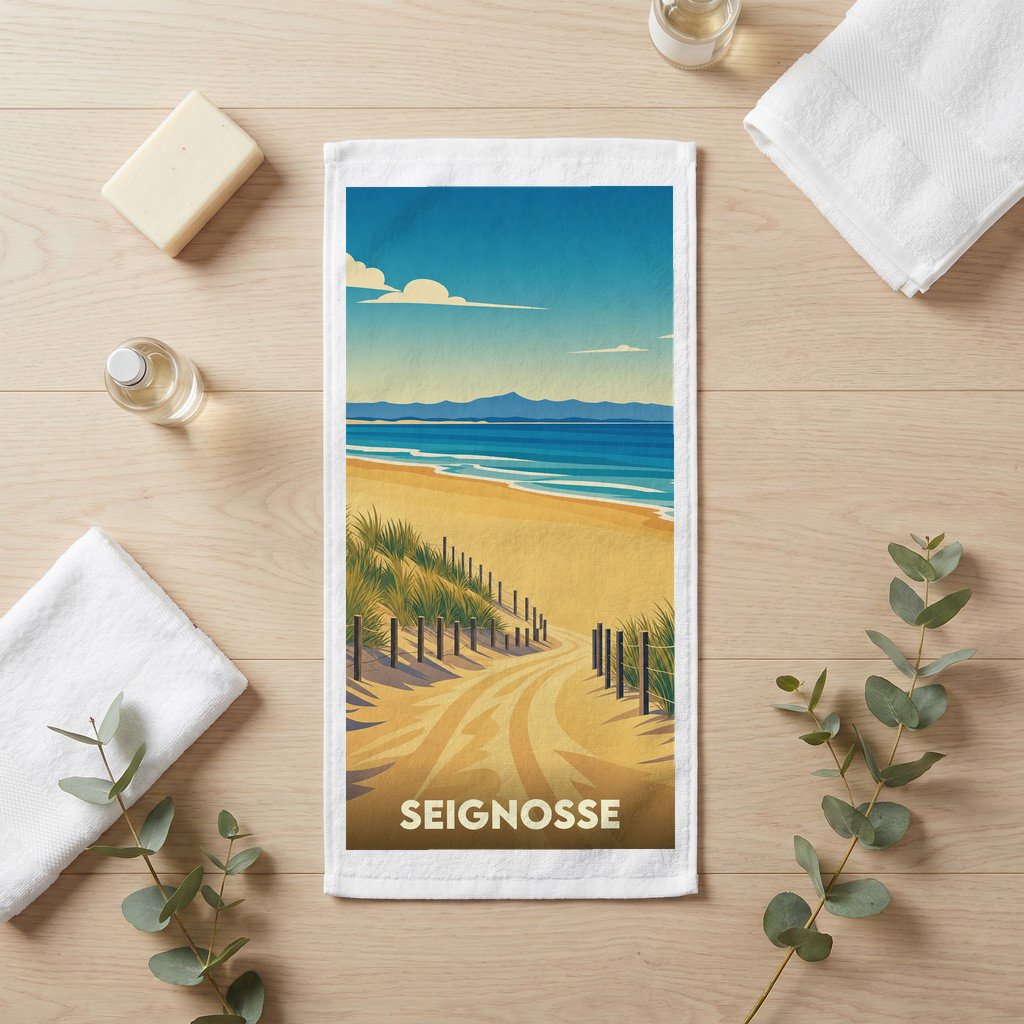 Serviette de bain souvenir de la ville de Seignosse avec une illustration stylisée de plage et de dunes.