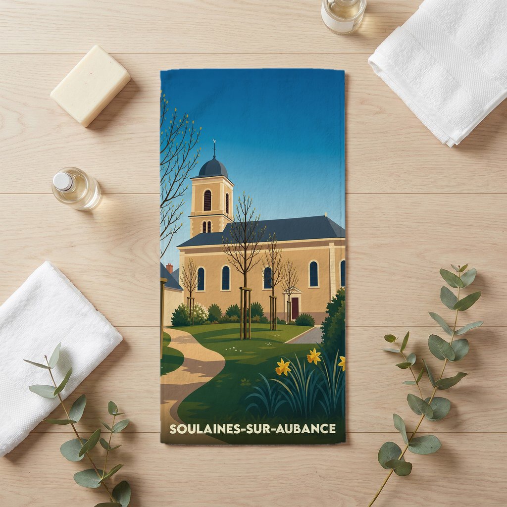 Serviette de bain souvenir de la ville de Soulaines-sur-Aubance avec une illustration stylisée d'une église.