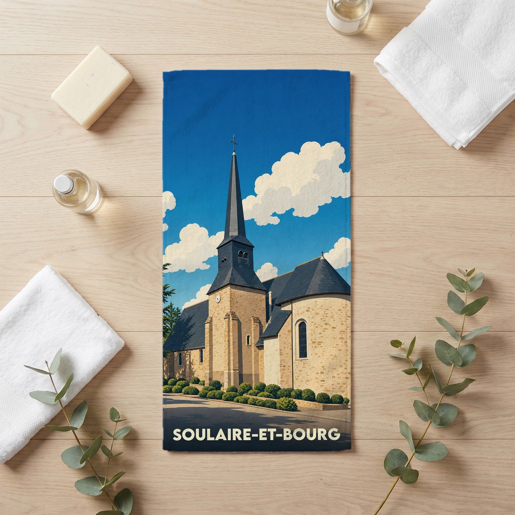 Serviette de bain souvenir de la ville de Soulaire-et-Bourg avec une illustration stylisée de son église.